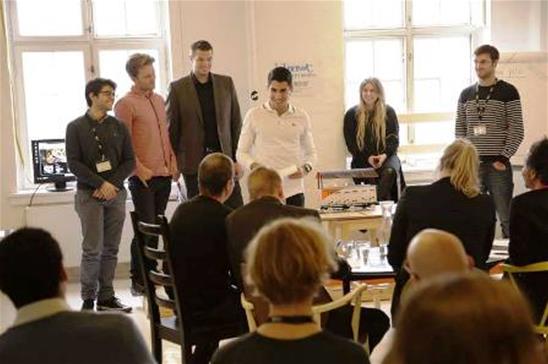 One of the groups present their concept to a panel of judges