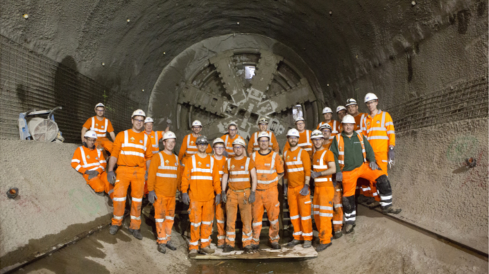 Workers stand in a Crossrail tunnel (Credit: Crossrail)