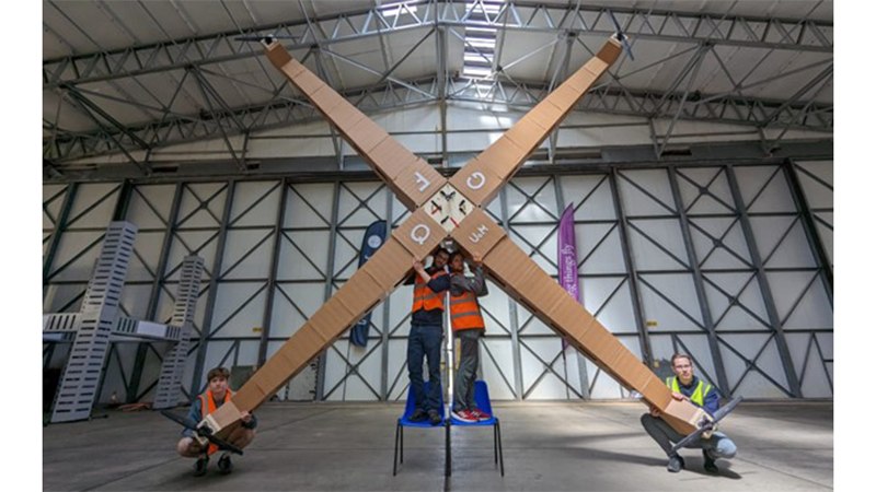 Manchester’s Giant Foamboard Quadcopter held aloft by some of the researchers and undergraduates who worked on the project (Credit: The University of Manchester)