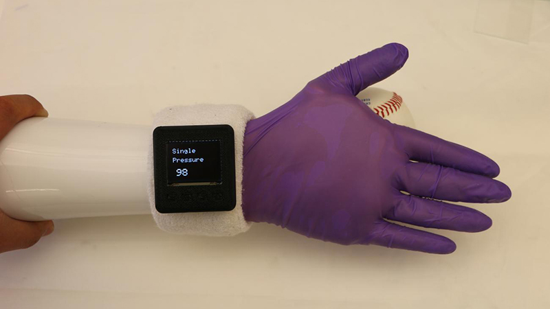 The glove uses thin, flexible electronics to sense softness and warmth