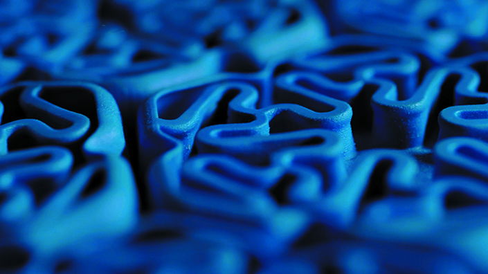 A close up of an injection moulded piece from Rheon Labs
