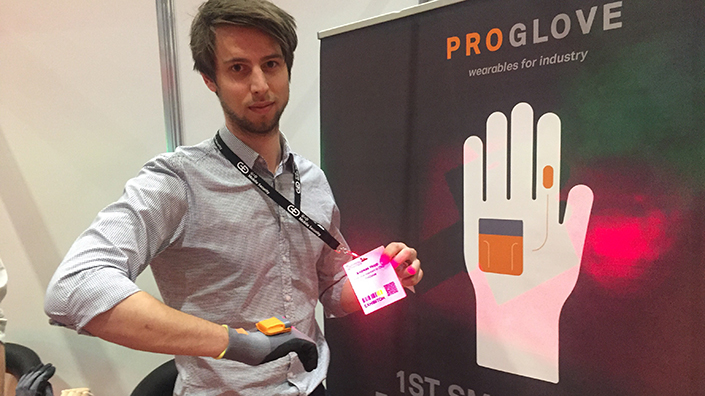 Aaron Windmüller demonstrates one of the ProGlove products. Another is wrist-mounted without a glove (Credit: Joseph Flaig)