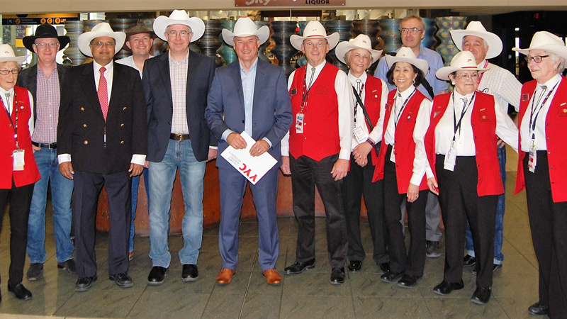 Jon Hilton being 'White Hatted' - a long-standing tradition in Calgary, Canada, as a symbol of hospitality - with the Prairies group of Chartered Engineers executive and Red Coat Volunteers