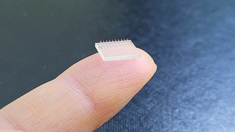 Scientists at the University of North Carolina and Stanford University used a 3D printer to produce a microneedle vaccine patch that dissolves into the skin (Credit: University of North Carolina at Chapel Hill)