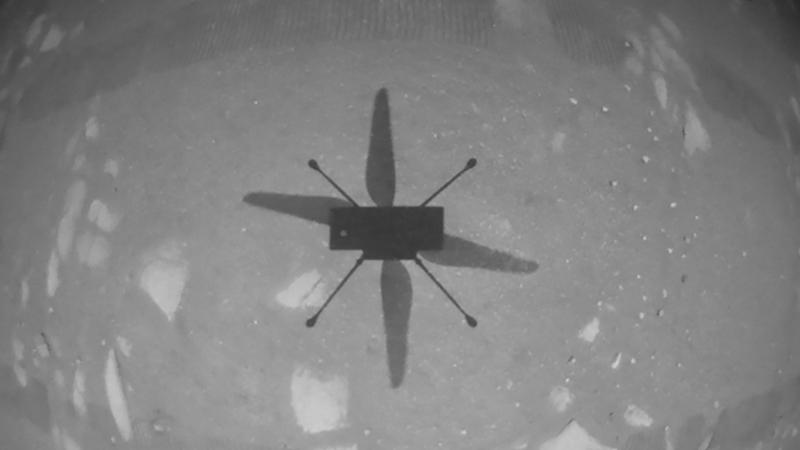 The first ever image sent back from a rotorcraft flight above the Martian surface. The image was taken by the Ingenuity Mars Helicopter's navigation camera, which autonomously tracks the ground during flight (Credit: NASA/ JPL-Caltech)