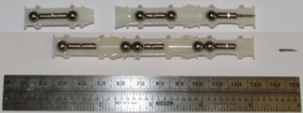 Cross-section: three component Gauss gun before and after firing